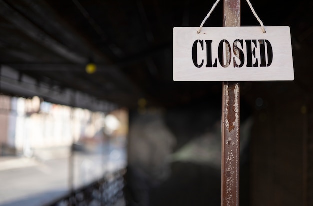 Free Photo closed sign hanging still life