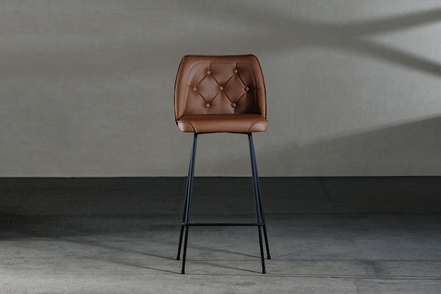 Free photo closeup of an armless chair with a concave back, loft-style furniture