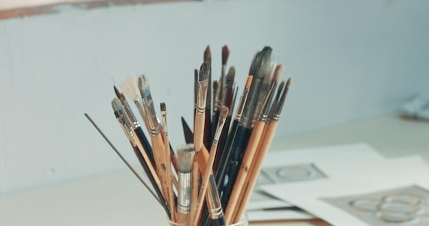 Free Photo closeup of art tools in studio paints brushes canvas pencil