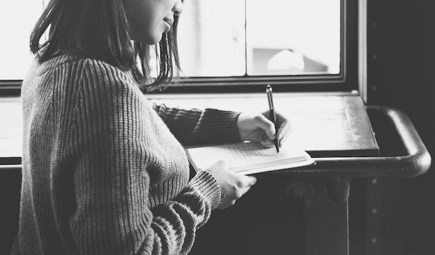 Free Photo closeup of asian woman writing notebook