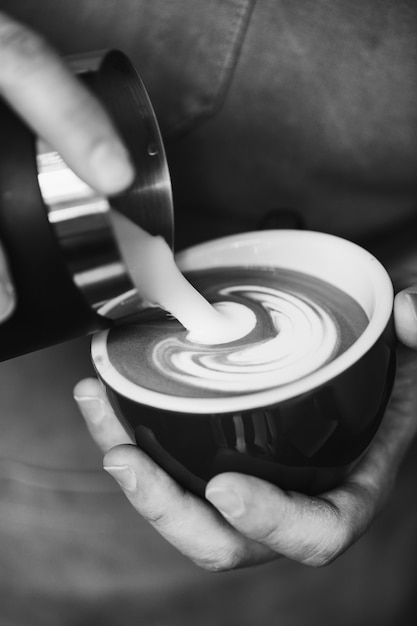 Closeup of barista making latte art