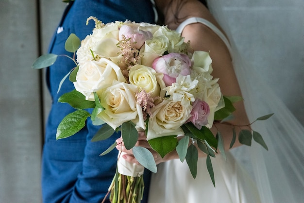 Closeup of a beautiful flower bouquet in the bride's hand