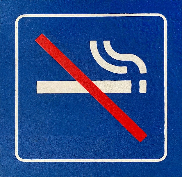 Free photo closeup of a blue no smoking sign