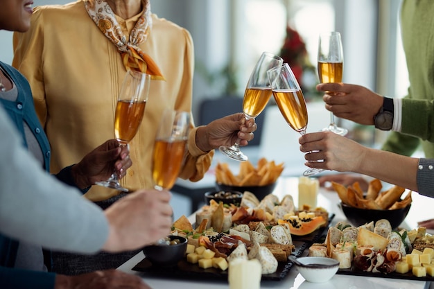 Free photo closeup of business people celebrating and toasting with champagne on office party