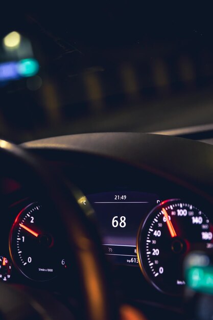 Closeup car speed indicators in a car at night