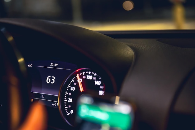 Free photo closeup car speed indicators in a car at night