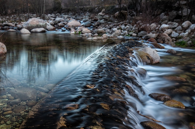 Closeup of a cascade of water in the forest