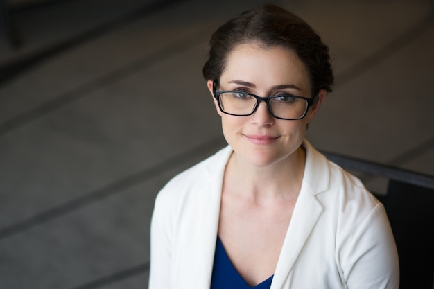 Free Photo closeup of content pretty businesswoman in glasses