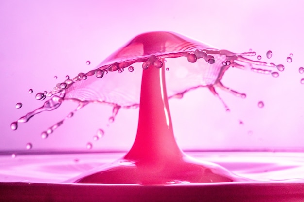 Free Photo closeup of a cool pink water splash background