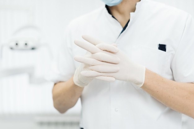 Closeup doctor's hands in gloves