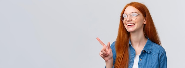 Free photo closeup dreamy and cheerful excited redhead female in glasses dreaming about future opportunities as