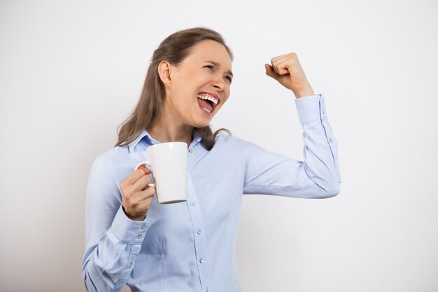 Closeup of Ecstatic Cheerful Woman Holding Mug