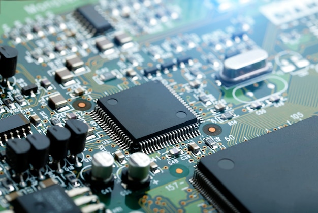 Free Photo closeup of electronic circuit board with cpu microchip electronic components background