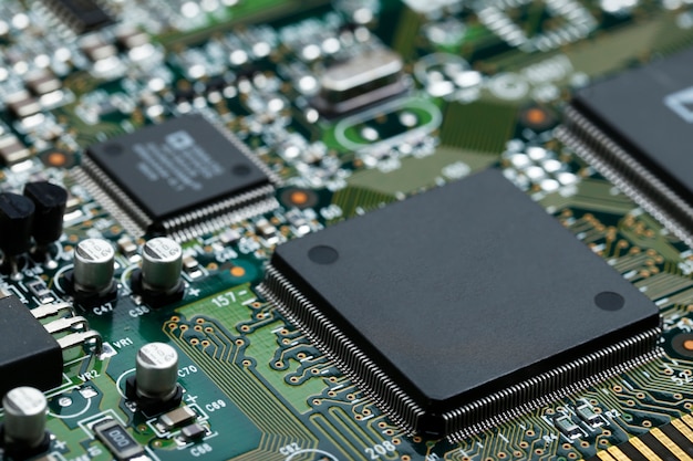 Free Photo closeup of electronic circuit board with cpu microchip electronic components background