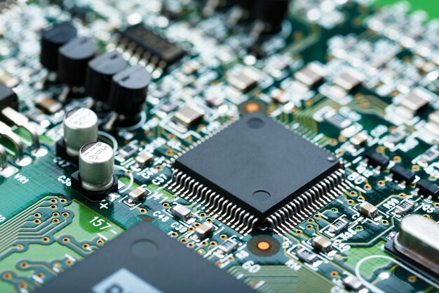 Closeup of electronic circuit board with CPU microchip electronic components background