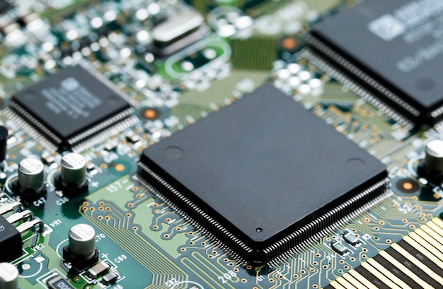 Free photo closeup of electronic circuit board with cpu microchip electronic components background