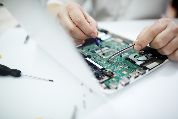 Closeup of Fixing Disassembled Laptop