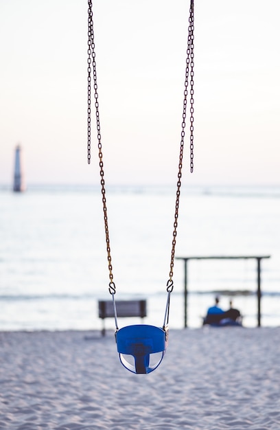 Free photo closeup focus shot of swings at the beach