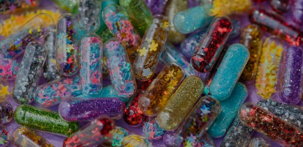 Closeup of glittery shimmery shiny pills capsule background