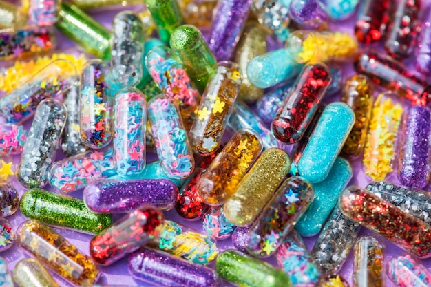 Free photo closeup of glittery shimmery shiny pills capsule background