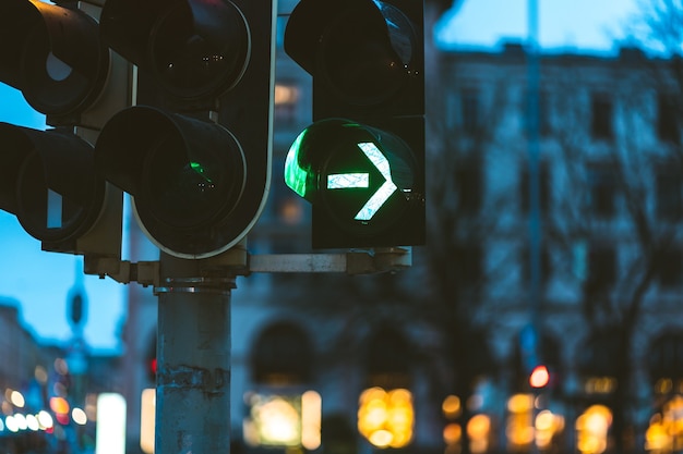 Closeup of the green traffic light in the evening