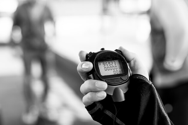 Closeup of hand holding stopwatch