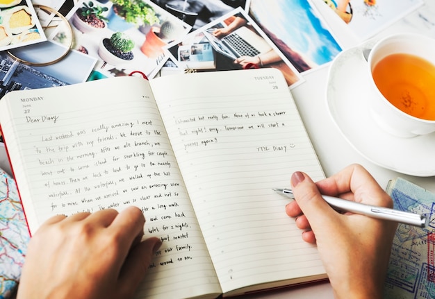 Free Photo closeup of hands writing a diary