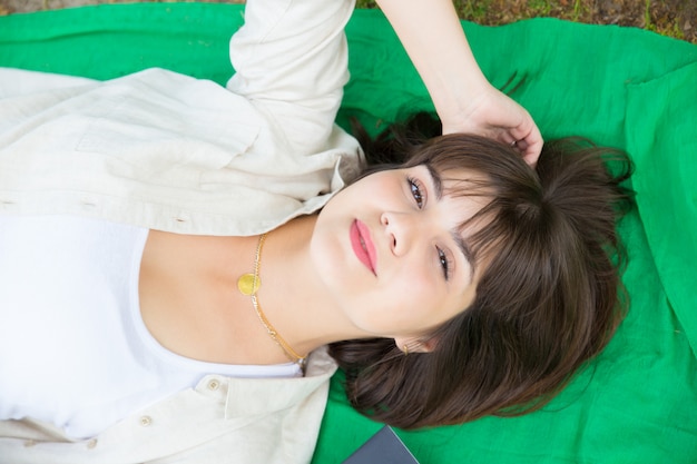 Closeup of happy serene girl relaxing outdoors