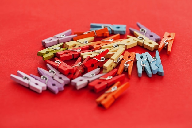 Free Photo closeup image of colorful office clothespins 