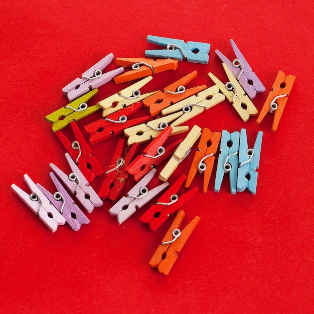 Free Photo closeup image of colorful office clothespins 