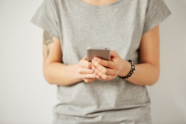 Closeup image of a teenager is searching information in network on mobile phone