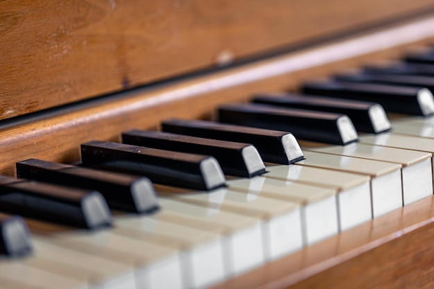 Closeup keys of an antique wooden piano