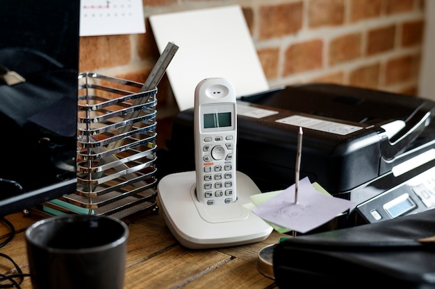 Free photo closeup of landline phone on wooden table