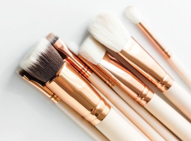 Closeup of makeup brushes on white background