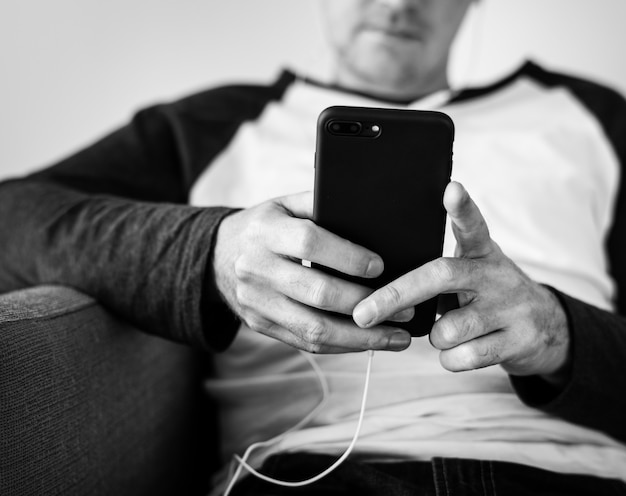 Closeup of man using mobile phone