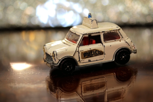 Free Photo closeup of an old mini police car toy