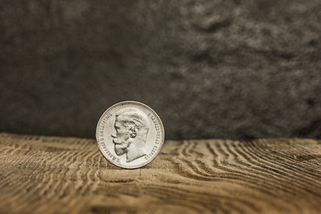 Closeup of old russian coin on a wooden table.