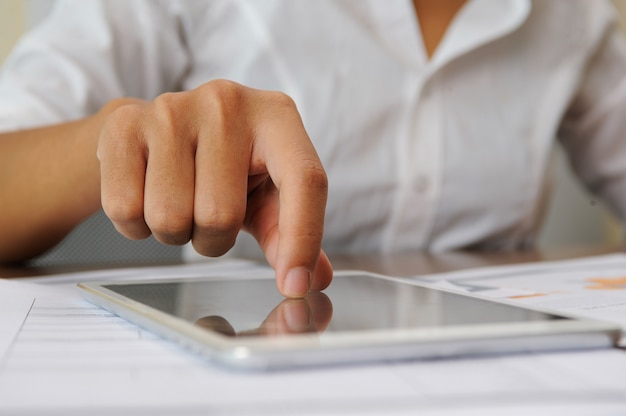 Closeup of person tapping on touchscreen