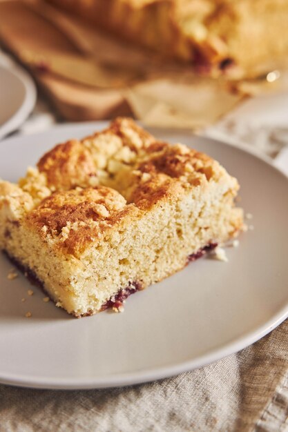 Closeup of a piece of delicious Jerry Crumble Sheet cake on white wood table