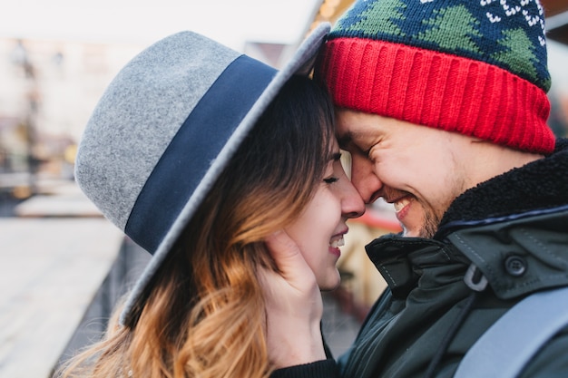 Free photo closeup portrait amazing couple in love enjoying time together on street. true lovely emotions, brightful feelings, happiness, christmas time, falling in love.