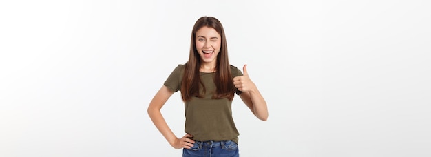 Closeup portrait of a beautiful young woman showing thumbs up sign isolate over white background