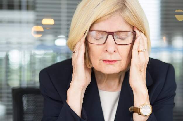 Closeup Portrait of Stressed Senior Business Woman