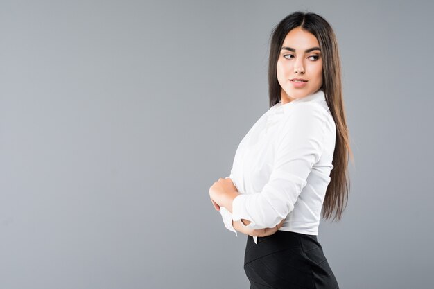 Closeup profile of confident business woman looking forward isolated on gray