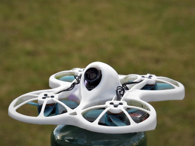 Free Photo closeup of a quadcopter in the blurred background