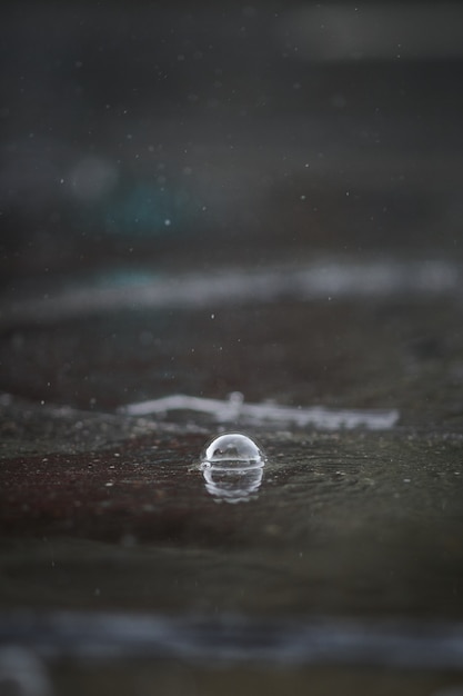 Free photo closeup of a rain bubble on the road