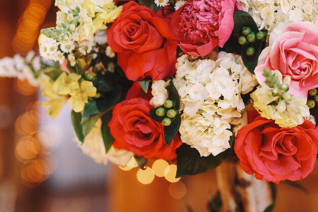 Closeup of red roses put in white bouquet