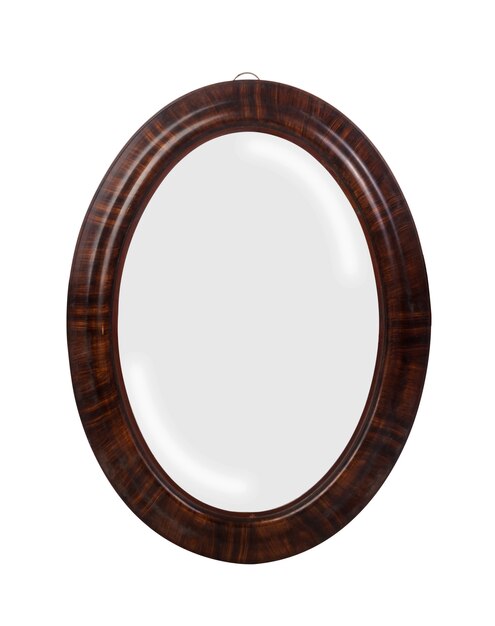 Closeup of a round mirror with brown borders isolated on a white surface