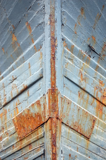 Free Photo closeup of rusty iron ship walls with grey paint on it