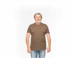 Free photo closeup of senior man's body in empty brown t-shirt isolated on white background. clothing, mock up for disign concept with copy space.  front view