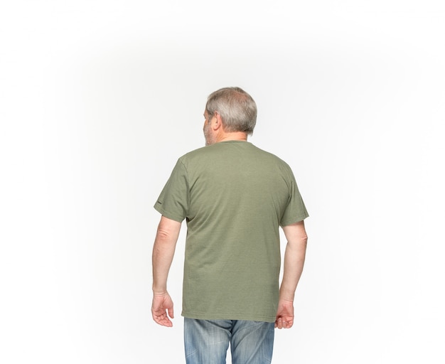 Free Photo closeup of senior man's body in empty green t-shirt on white.